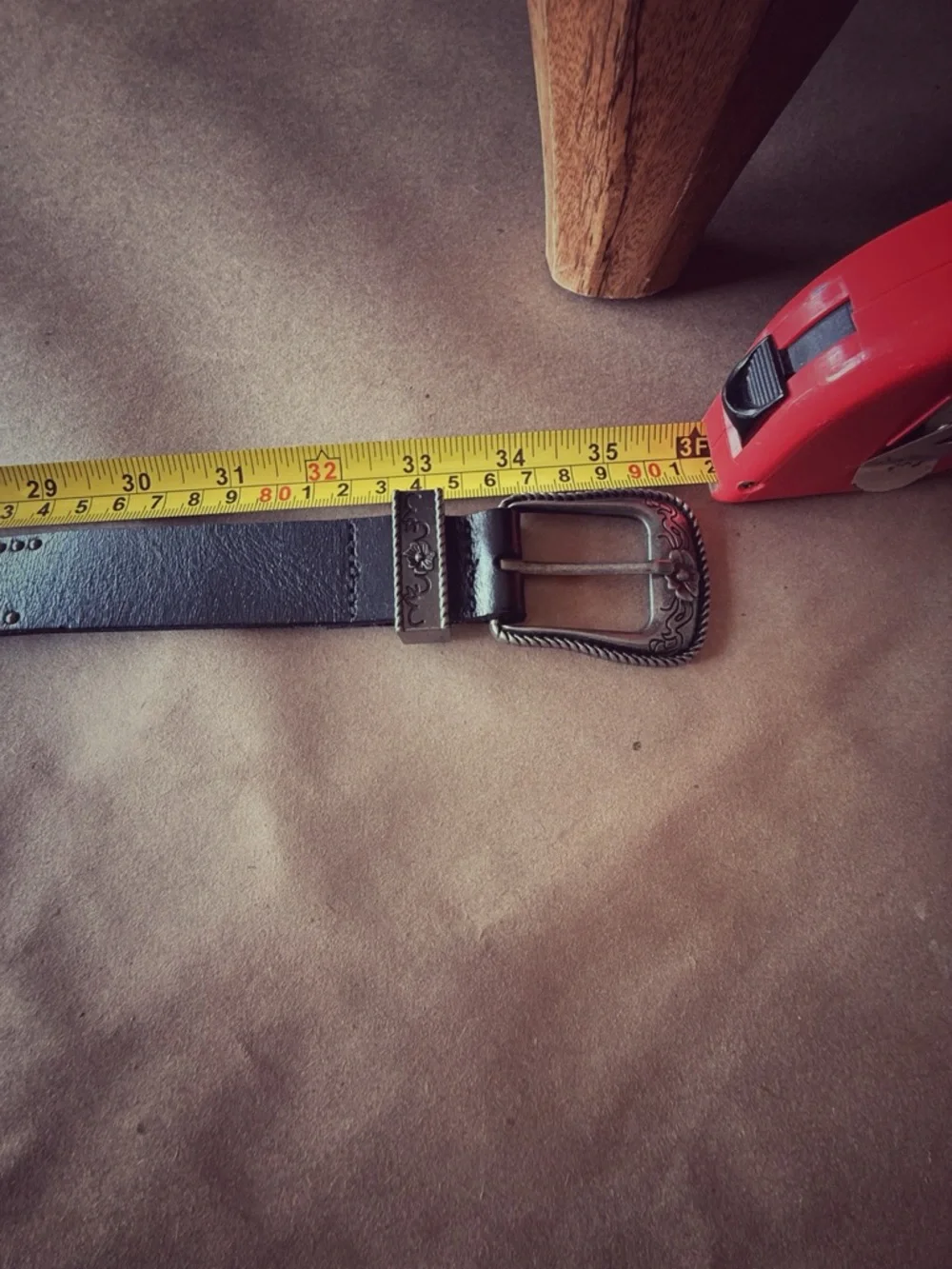 Boutique item with premium craftsmanship and distinctive double buckle design.